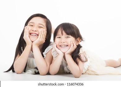 Happy Two Asian Girls  On The White Background