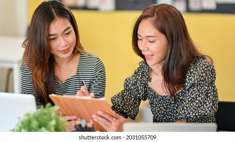 Happy Two Business Worker Looking On The Final Report Together, Satisfied With The Business Plan Result At Office Room, Teamwork