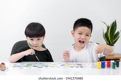 Happy Two Little Asian Kid At The Table Draw With Watercolor Learning And Education Of Kid.