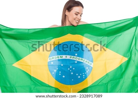 Happy undressed woman covering her body by Brazil flag isolated on white