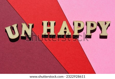 Happy, Unhappy, word in wooden alphabet letters isolated on background as banner headline