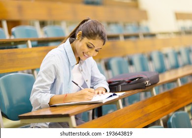 happy university student studying in lecture room