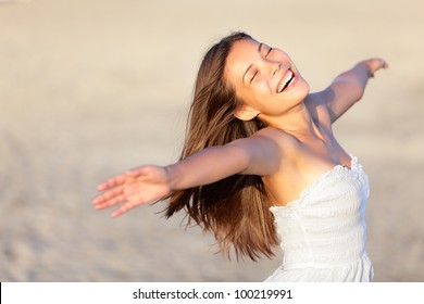 Happy Vacation Woman On Beach Summer Holiday In Cheerful Bliss Enjoying The Sunshine. Beautiful Ethnic Girl In Her 20s.