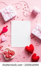 Happy Valentines Day Composition. Blank Greeting Card Mockup, Gift Boxes, Red Hearts, Confetti On Pink Background