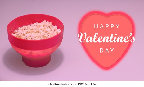 Happy Valentine's day date plan concept. Red bowl of popcorn and heart symbol. - Powered by Shutterstock