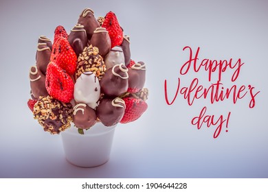 Happy Valentine's Day Greeting Card With Red Lettering; A Bunch Of Edible Flowers, Arrangement Of Chocolate Dipped Strawberries Isolated On White Background