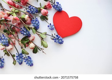 happy valentine's day greeting card. bouquet of flowers and red heart on white background 