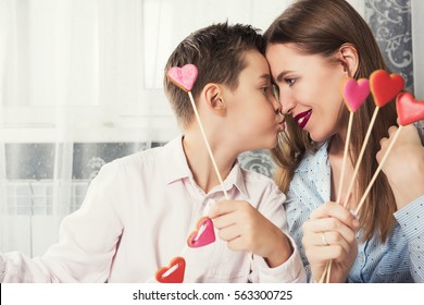 Happy Valentines Day or Mother day. Young boy spend time with her mum and celebrate Mom Teaches Little Daughter Do Makeup Stock Photo (Edit Now ...
