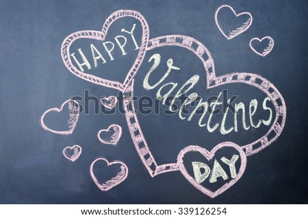 happy Valentines day written on the chalk Board. toning. selective focus