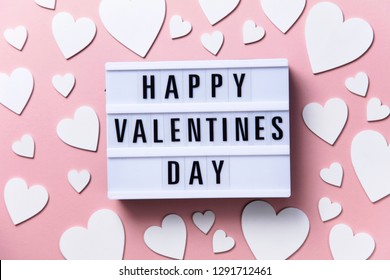 Happy Valentin's Day lightbox message with white hearts on a pink background - Shutterstock ID 1291712461