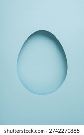 Happy vertical Easter greeting featuring a paper egg cutout on a pastel blue minimal background, ideal for cards, templates and spring celebration designs and mockups