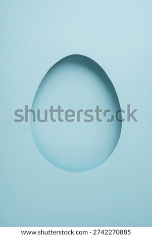 Happy vertical Easter greeting featuring a paper egg cutout on a pastel blue minimal background, ideal for cards, templates and spring celebration designs and mockups