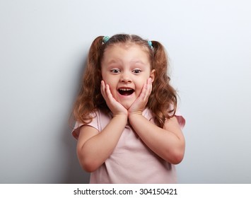 Happy Very Excited Kid Girl With Open Mouth Looking. Closeup Portrait