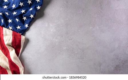 Happy Veterans Day concept. American flags against gray stone  background. November 11.