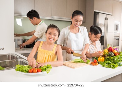 Happy Vietnamese Family Cooking Dinner Together