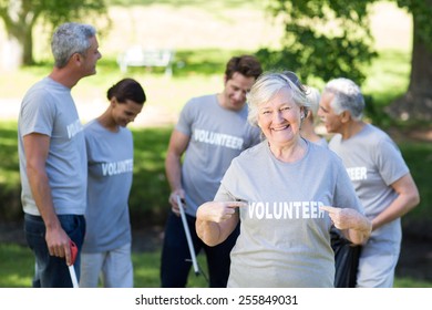 Happy volunteer grandmother with thumbs up on a sunny day - Powered by Shutterstock