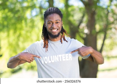 Happy Volunteer In The Park On A Sunny Day