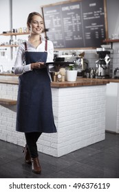 Happy Waitress Holding A Tray With A Cup Of Coffee, Selective Focus