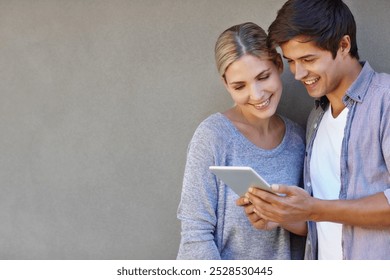 Happy, wall background and couple on tablet for online chat, social media and bonding on weekend. Relax, dating and man and woman on digital tech for internet, website and networking in urban town - Powered by Shutterstock