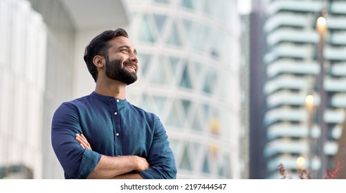 Happy wealthy rich successful indian business man standing in big city modern skyscrapers street on sunset thinking of successful future vision, dreaming of new investment opportunities concept. - Shutterstock ID 2197444547