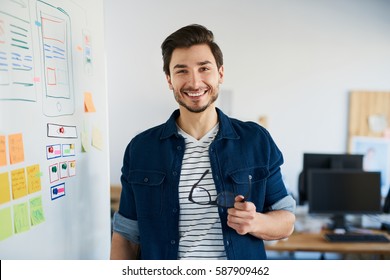 Happy Web Developer Standing In Office