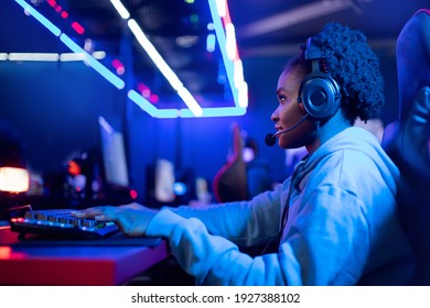 Happy Webcam Streamer African Woman Play Gamer Playing Online Video Games Computer Neon Color.