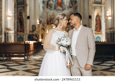 Happy wedding couple bride and groom leaving the church after the wedding ceremony - Powered by Shutterstock