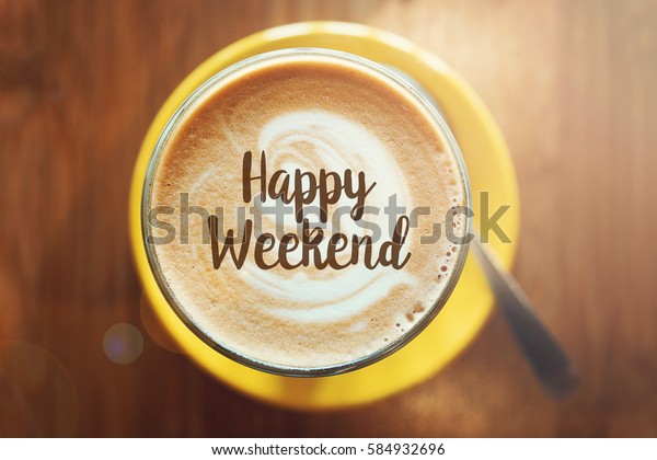 HAPPY WEEKEND word on\
a cup of hot coffee