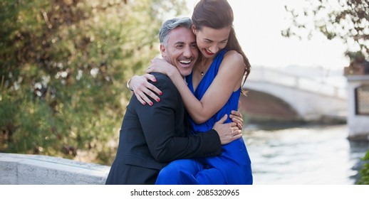 Happy Well Dressed Couple Hugging