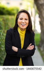 Happy Well Dressed Mature Asian Woman Smiling.