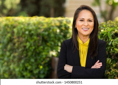 Happy Well Dressed Mature Asian Woman Smiling.