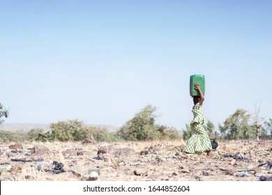 Happy West African Schoolgirl Engaged with Fresh Water in Bamako