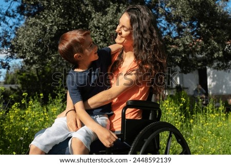 Similar – Image, Stock Photo Joyful wheelchair user with assistant enjoying outdoors