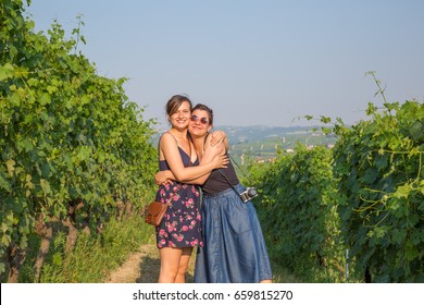 Happy Wine Tourists Visiting Vineyards For A Tasting Wine Tour