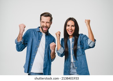 Happy as winners caucasian young spouses girlfriend and boyfriend couple bet, playing online casino, celebrating winning money in lottery isolated in white background. Sale and discount