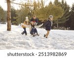 Happy winter family snow sledging mother in wintertime, playing during woodland nature adventure on Christmas, New Year active holiday fun outdoor, family fun ideas, spending vacation together outside