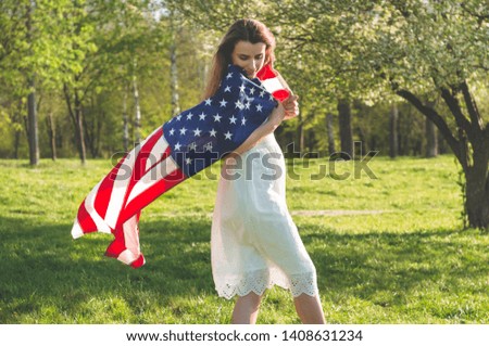 Happy woman with American flag USA celebrate 4th of July