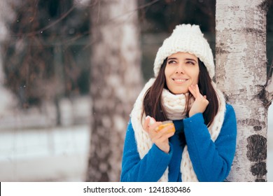 Happy Woman Applying Skin Moisturizing Cream Outdoors In Winter. Cautious Girl Using Anti Aging Sunscreen In Wintertime 

