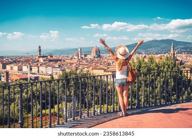 Happy woman with arms raised up enjoying panoramic of Florence Cityscape- tour tourism,travel,vacation in Italy-Europe, Firenze  
