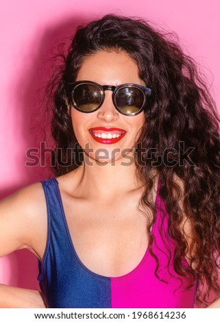 Similar – Woman with sunglasses looking at camera over garden fence