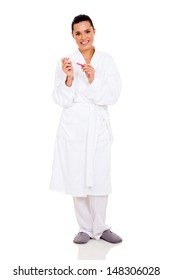 Happy Woman In Bathrobe Holding Pregnancy Test On White Background