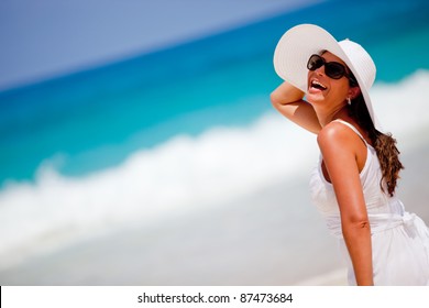 Happy Woman At The Beach Enjoying Her Summer Holidays