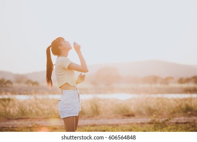 Happy woman blowing bubbles  in meadow. travel and sunset, soft and select focus. - Shutterstock ID 606564848