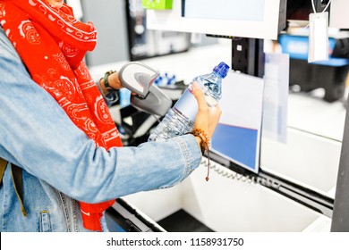 Happy Woman Buying Bottle Of Water At Supermarket Self Service Cash Register Check Out