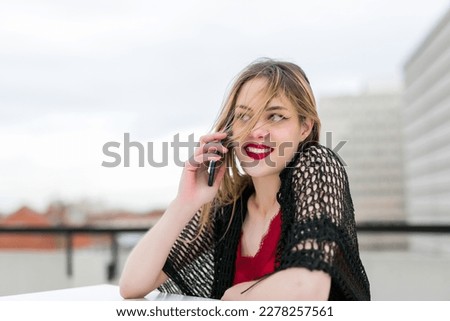 Happy woman calling on the phone in a restaurant. Entrepreneurship Concept
