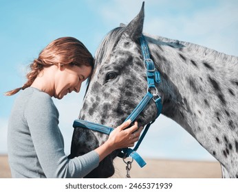 Happy, woman and calm horse on farm for equestrian, training or adventure in countryside. Girl, care and stroke animal on ranch with peace and rider with healthy pet or vet helping at sanctuary - Powered by Shutterstock