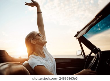 Happy woman, celebration and driving convertible car for road trip, adventure and freedom on holiday or vacation. Excited young driver in luxury vehicle with dance, carefree and travel in sunset - Powered by Shutterstock