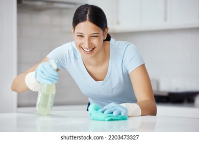 Happy Woman Cleaning Home Kitchen, Spray Product Cleaner With Safety Gloves And Polish Table With Cloth. Domestic Happiness, Young Girl Disinfect Counter With Sanitary Detergent And Tidy Apartment