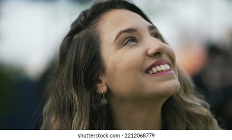 Happy Woman Closeup Face Looking Up At Sky Smiling. One Hopeful Hispanic 20s Adult Girl