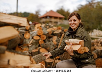 Happy Woman Collecting Fire Wood.